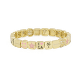 Gold bracelet with various charms on a white background