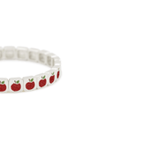Bracelet with red apple pattern on a white background