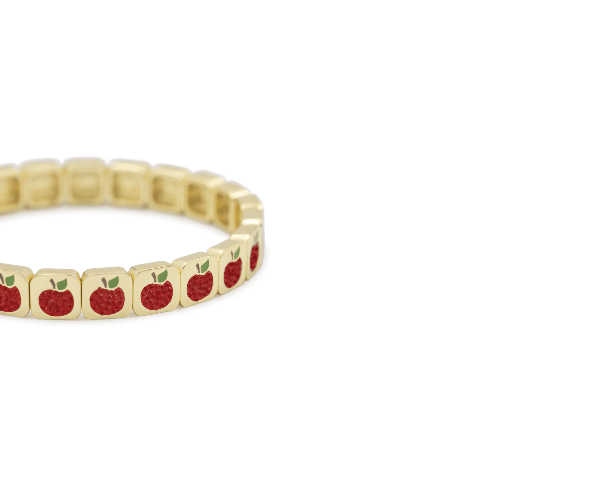 Gold bracelet with red apple charms on a white background