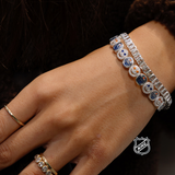Silver-tone charm bracelet with oval links and round team-logo discs