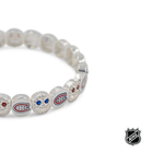 Silver-tone NHL bead bracelet close-up with blue and red logo charms