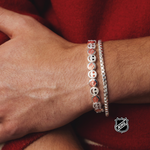 Silver-tone NHL charm bracelet with red-and-white round team-logo medallions