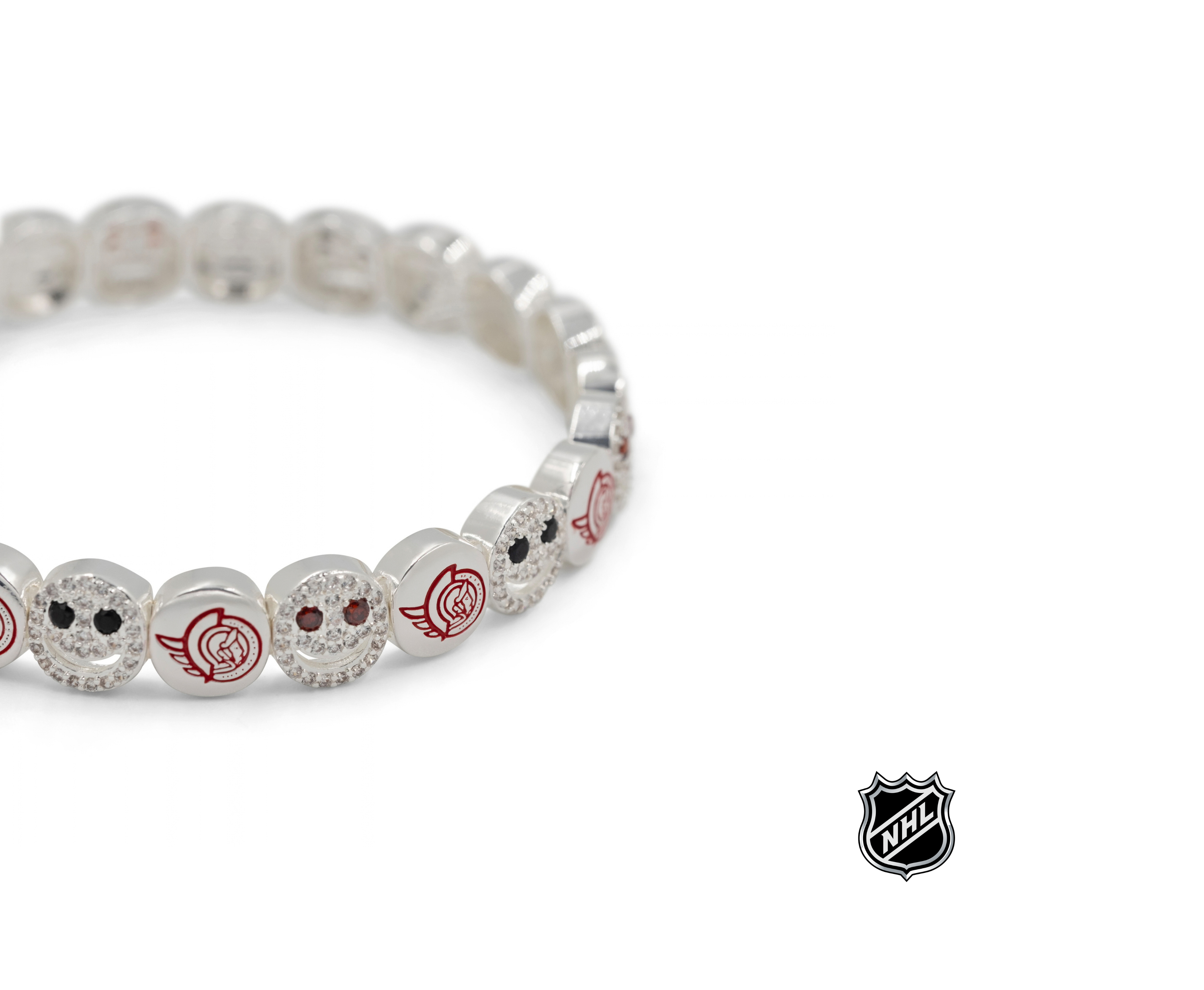 Silver-tone NHL bead bracelet close-up with red and white team logo charms