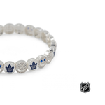 Silver-tone NHL bead bracelet close-up with blue logo charm and crystal beads
