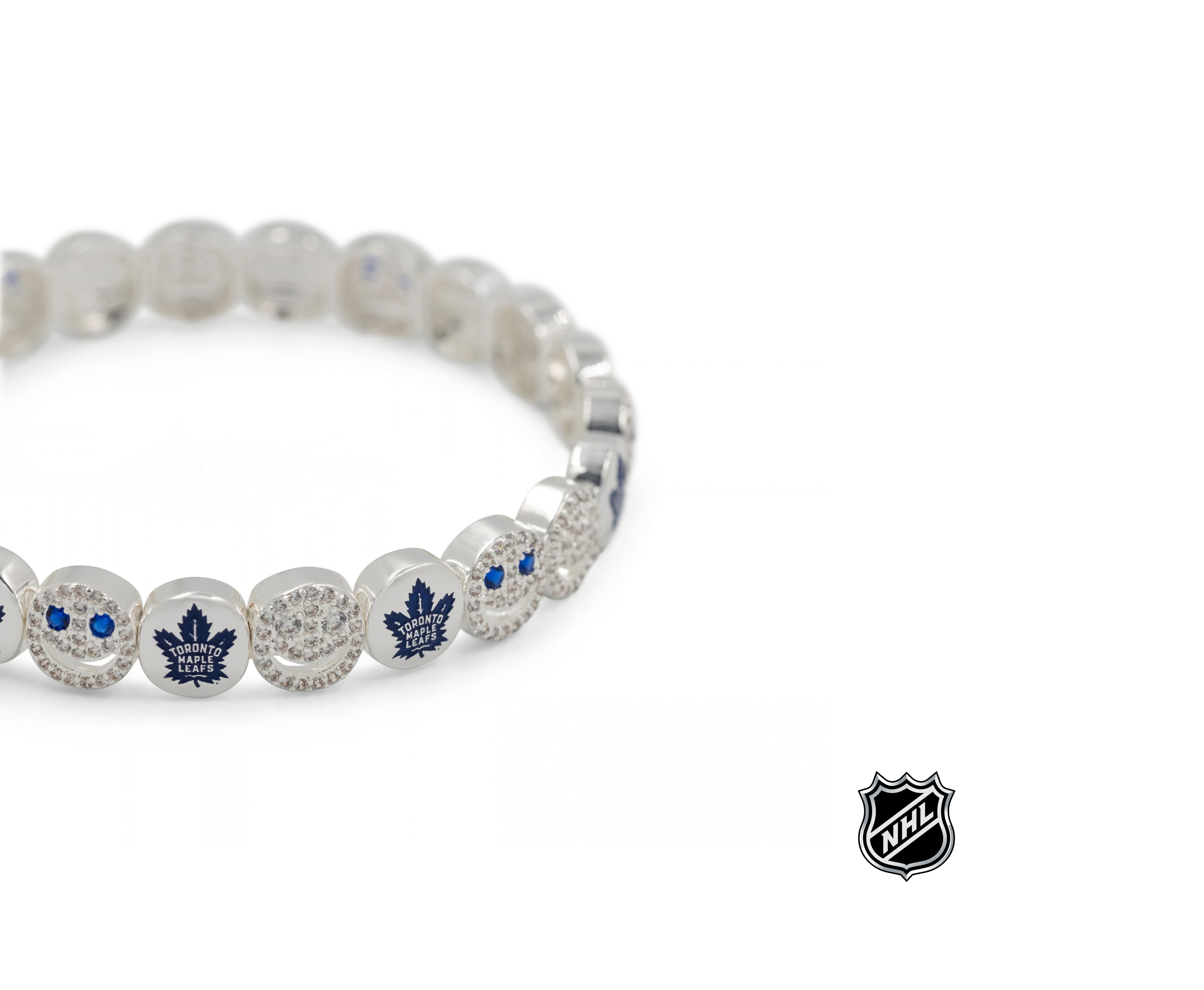 Silver-tone NHL bead bracelet close-up with blue logo charm and crystal beads