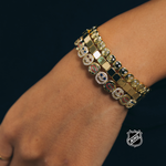 Gold-tone NHL charm bracelet with rectangular links and round team-logo stones