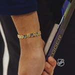 NHL® bracelet, gold-tone link with round logo medallions on wrist