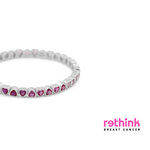 Silver heart tennis bracelet with purple heart-cut gemstone settings