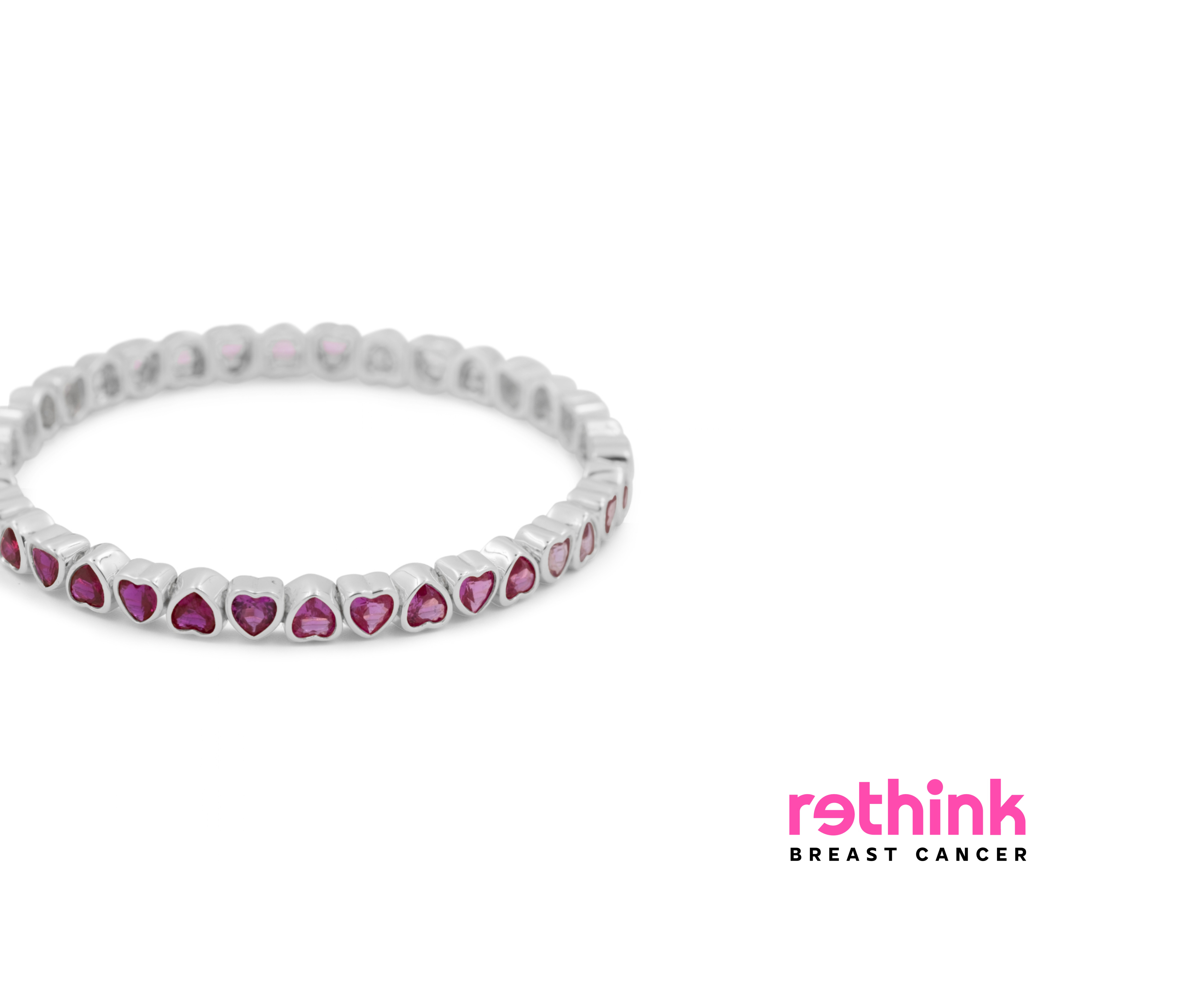 Silver heart tennis bracelet with purple heart-cut gemstone settings