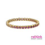 Yellow gold heart tennis bracelet with purple heart-cut stones