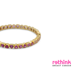 Yellow gold heart tennis bracelet with purple heart-cut gemstones