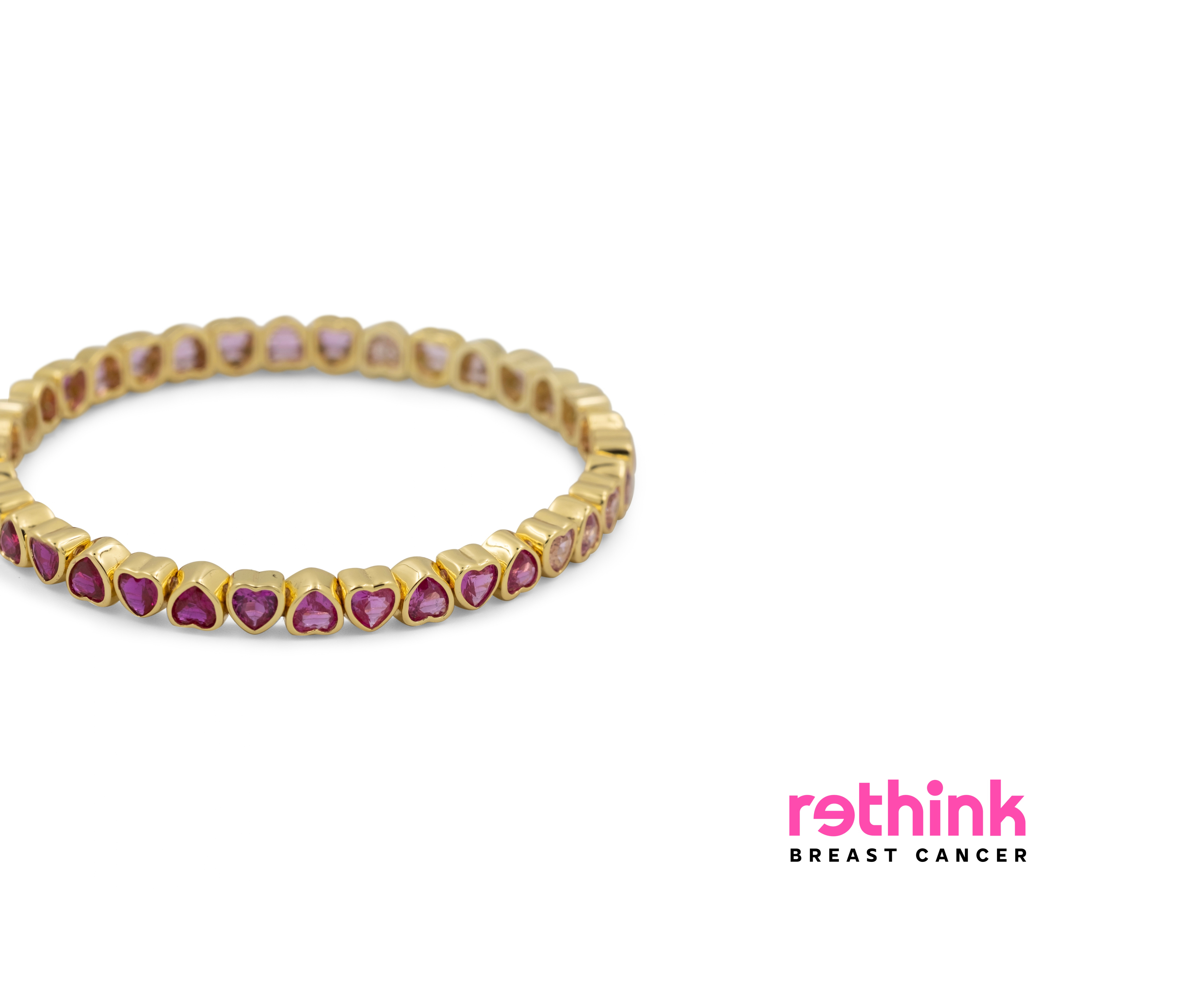 Yellow gold heart tennis bracelet with purple heart-cut gemstones