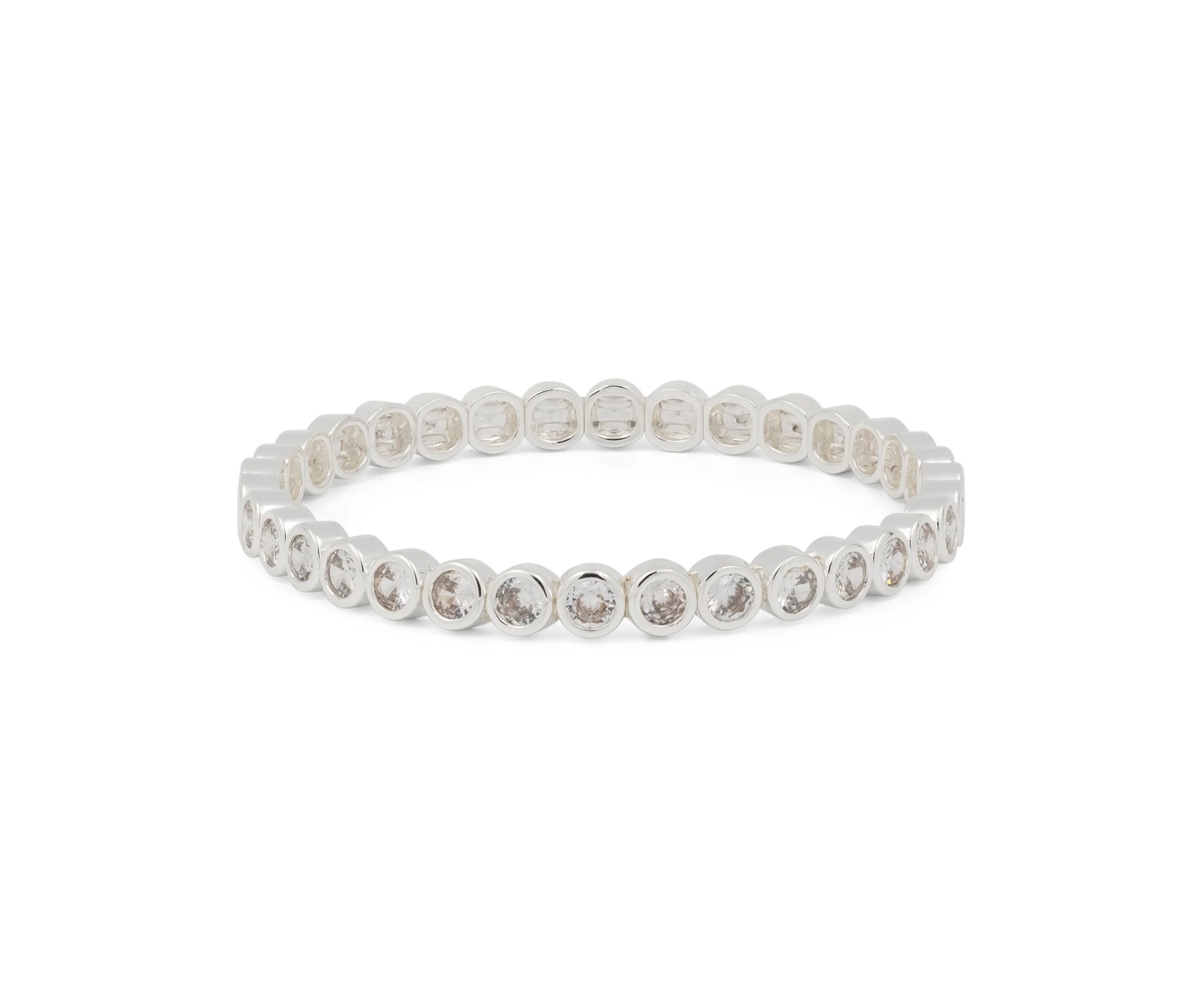 Silver tennis bracelet with round bezel-set stones in a flexible oval band