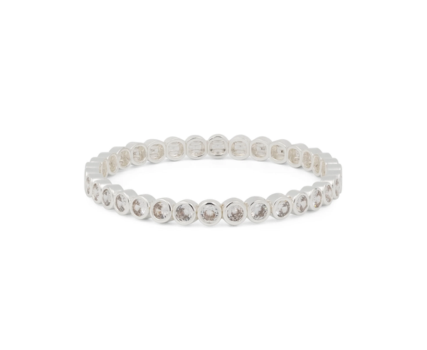 Silver tennis bracelet with round bezel-set stones in a flexible oval band