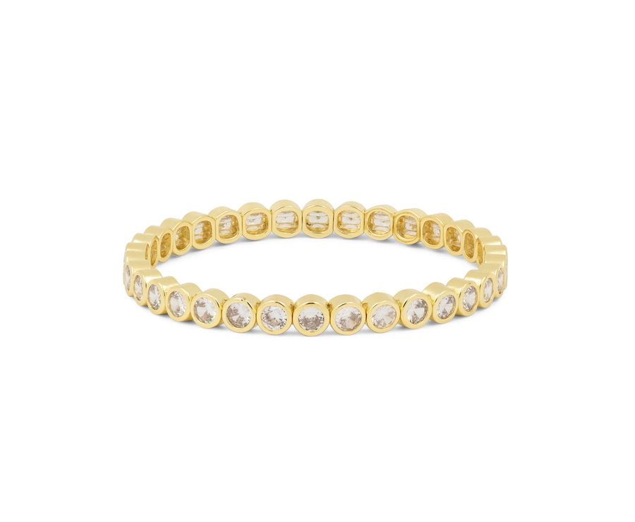 Yellow gold tennis bracelet with round bezel-set stones in a flexible oval band