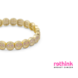 Yellow gold pavé beaded bracelet with round pink and clear stone details