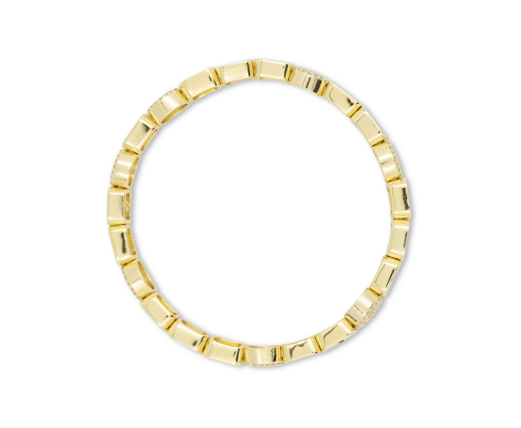 Gold ring with a geometric design on a white background