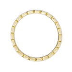 Gold ring with a geometric design on a white background