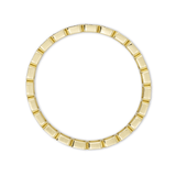 Gold ring with a geometric design on a white background